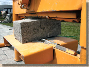 How do you cut concrete blocks to make them smaller?