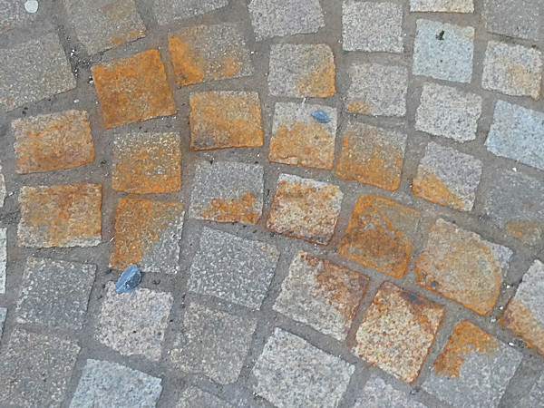 rust stained paving