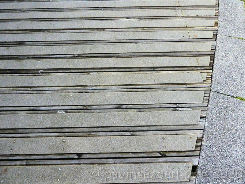 decking with surface attached safety strips