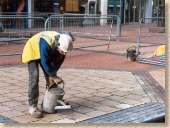 pouring a slurry into the joints