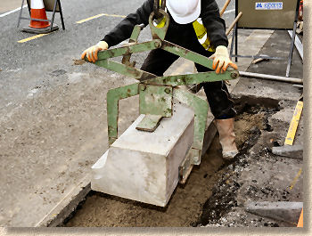 lifting kerb into position