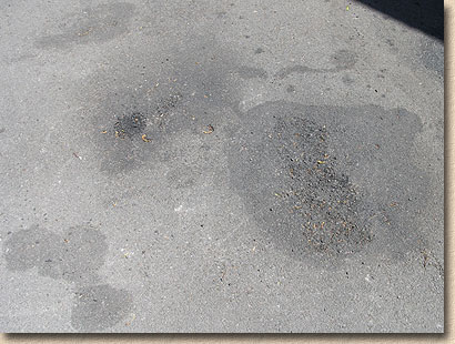 oil damaged tarmac