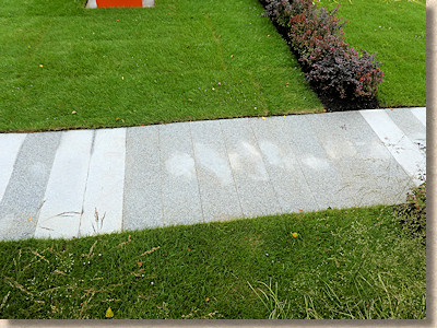 damp marks on granite paving