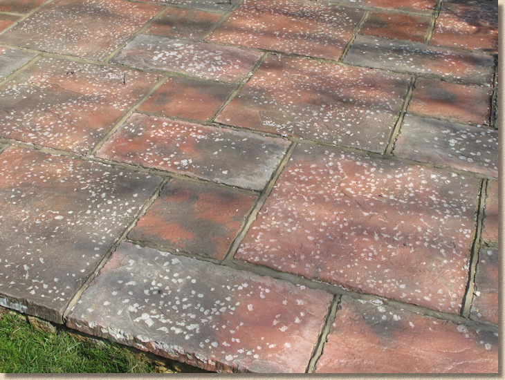 blotchy sealant on concrete paving