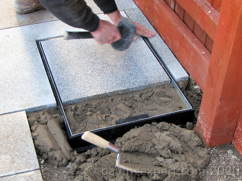 lay first paving in recess tray cover